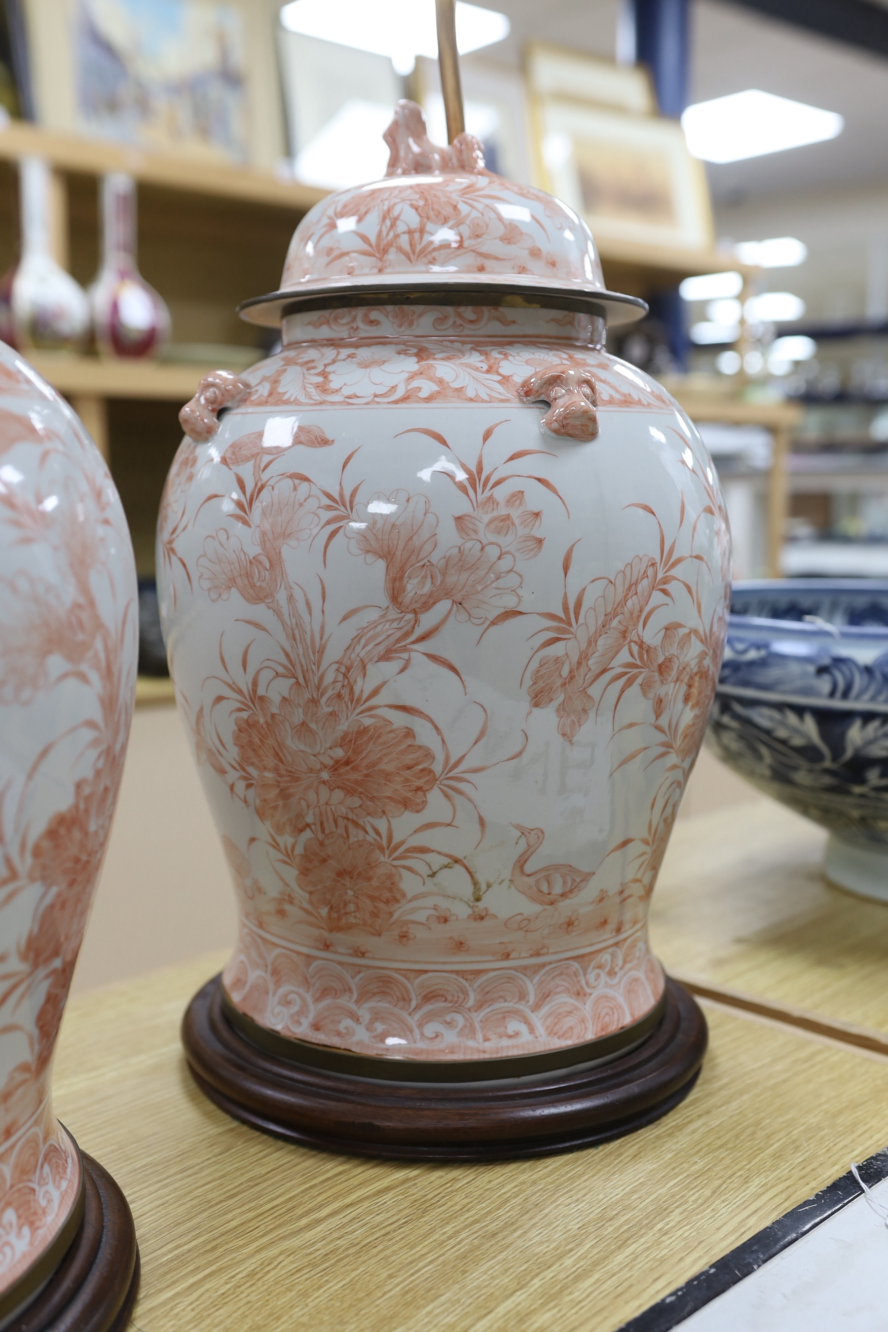 A pair of Chinese style iron red porcelain table lamps